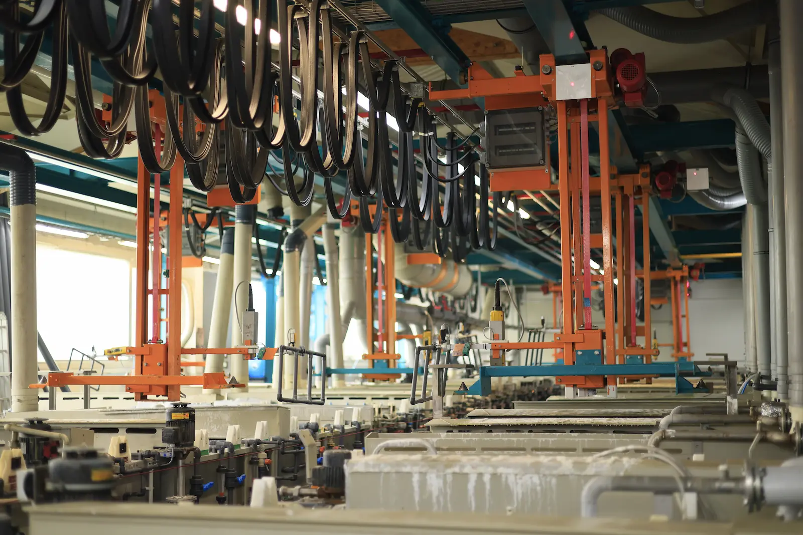 Fully automated electroplating line with overhead transport system and process-controlled treatment stages, ensuring consistent, high-precision coating across complex components.